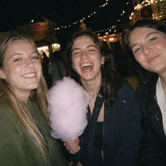 Sharing fairy floss under the lights at a night market