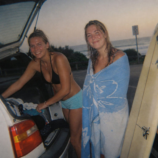 Drying off next to a van at a surf carpark