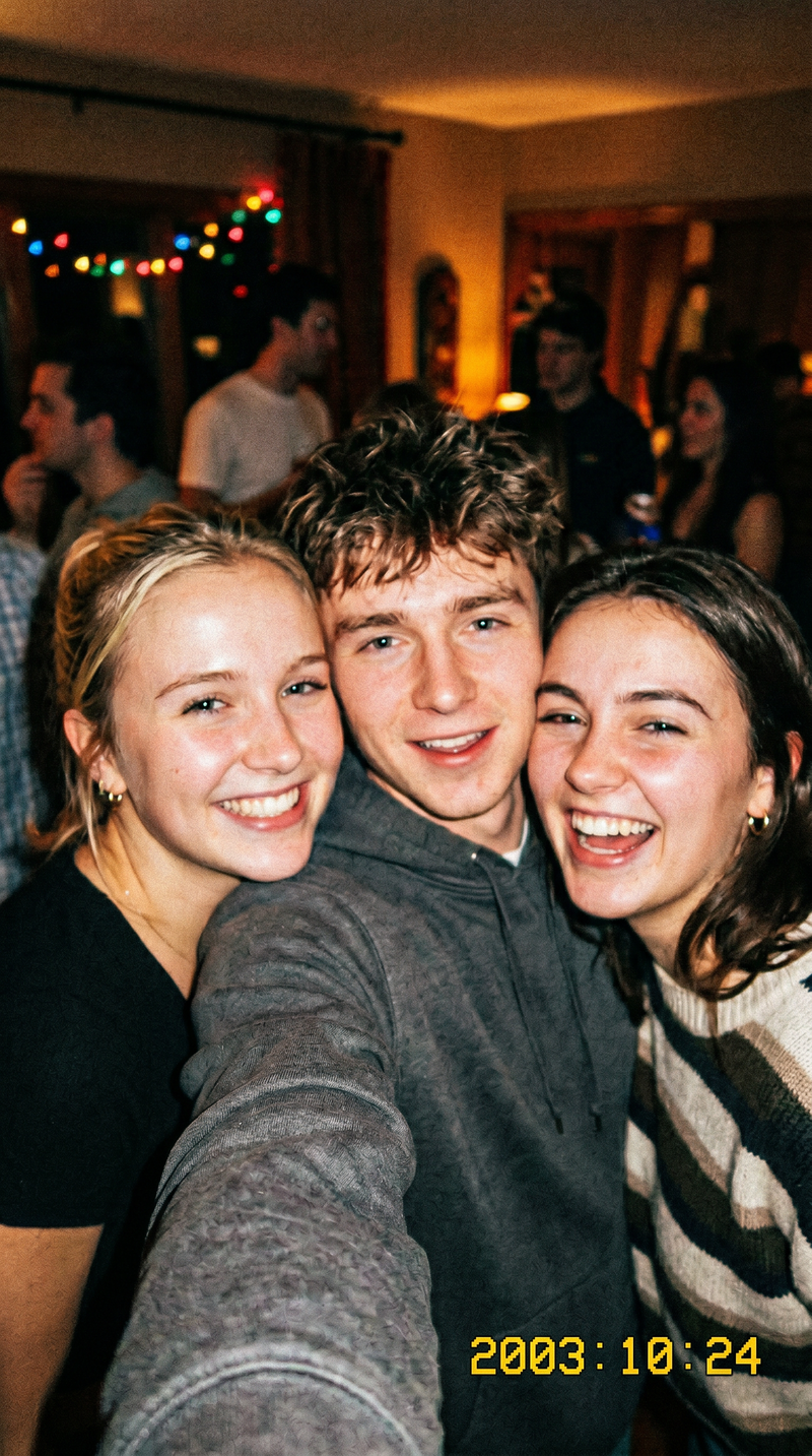 Three friends taking a selfie together in a social setting with blurred background